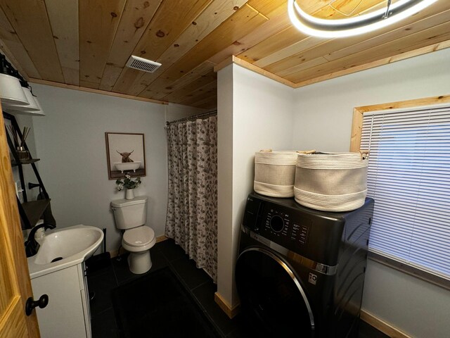 bathroom featuring vanity, toilet, wood ceiling, and washer / clothes dryer