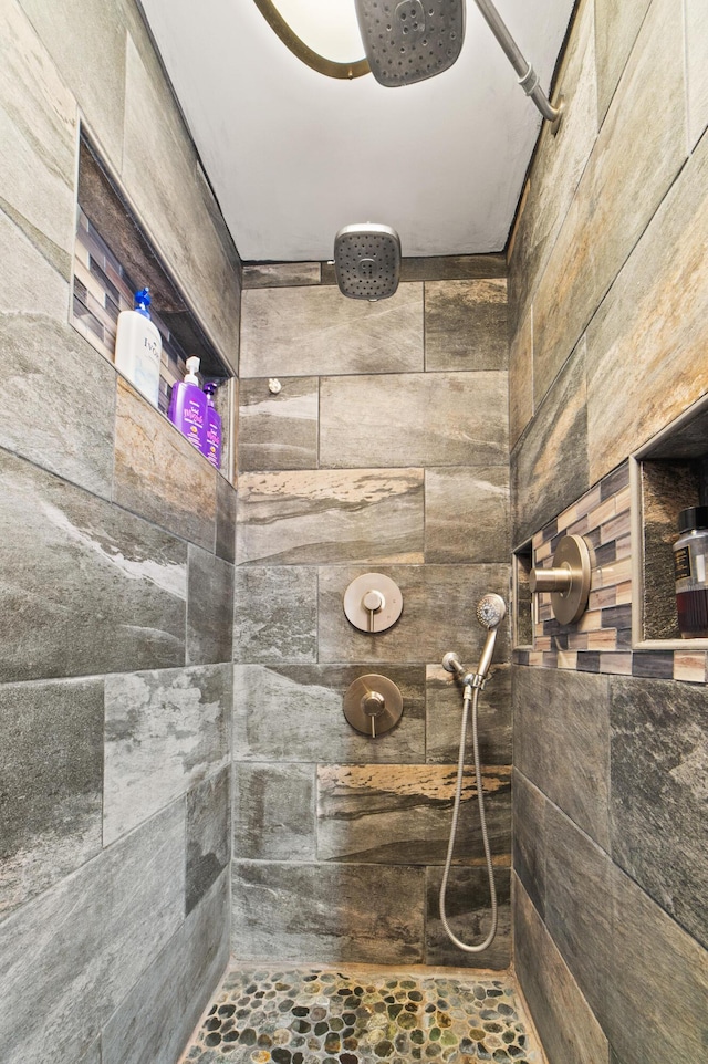 bathroom with tiled shower