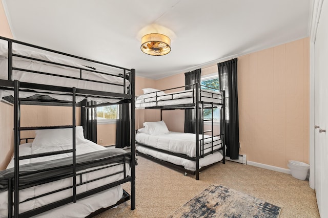 bedroom featuring multiple windows and light colored carpet