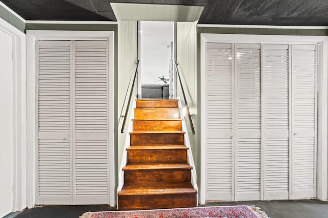 staircase with concrete flooring