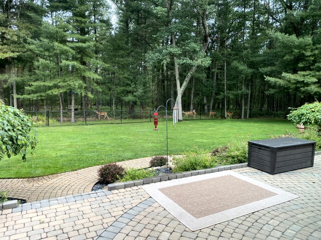 exterior space featuring a patio area and fence