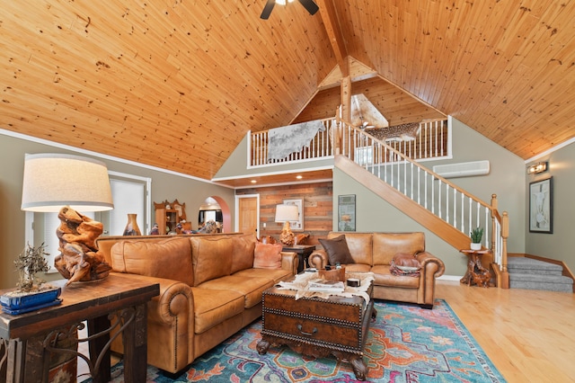 living room featuring hardwood / wood-style flooring, wood ceiling, high vaulted ceiling, ornamental molding, and ceiling fan