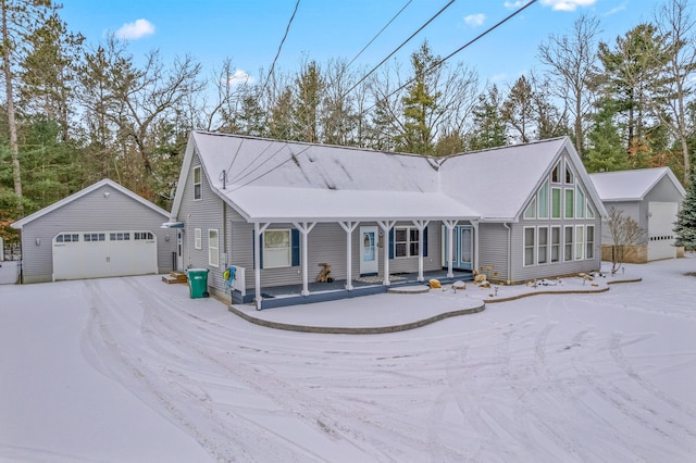 view of front of property with an outbuilding and a detached garage