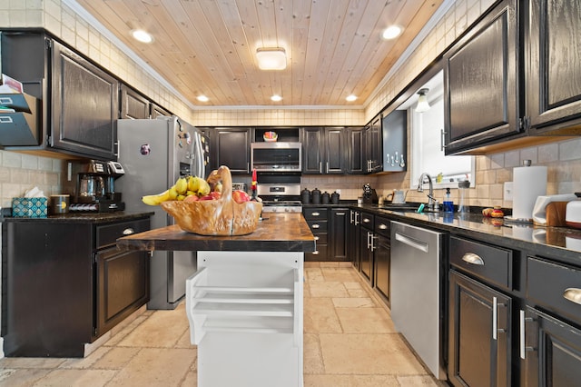 kitchen featuring wooden ceiling, stone tile floors, stainless steel appliances, butcher block counters, and a sink