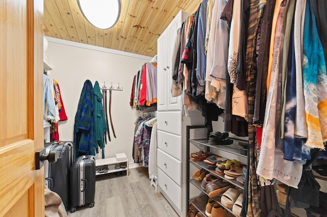 walk in closet featuring light wood finished floors