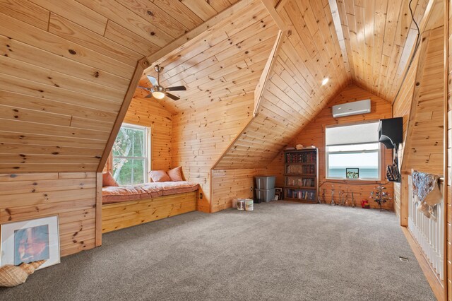 home office with carpet flooring, ceiling fan, and vaulted ceiling