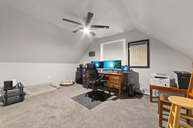 office area with lofted ceiling, carpet, and a ceiling fan