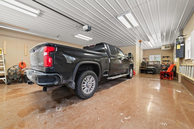 garage with a wall mounted air conditioner