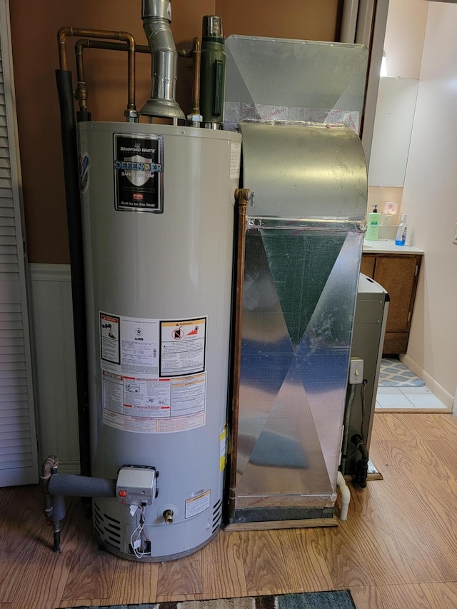 utility room with gas water heater