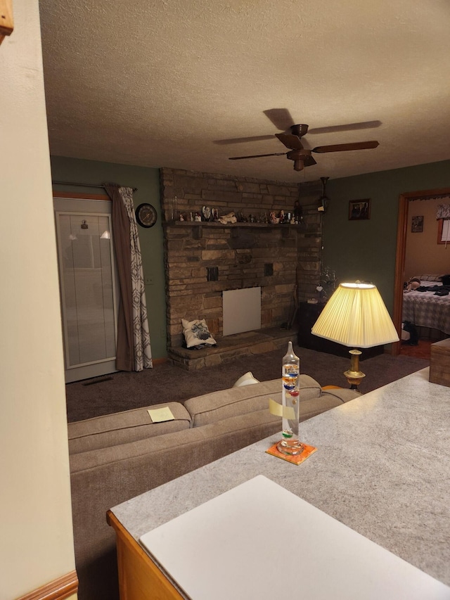 living room featuring carpet floors and a textured ceiling