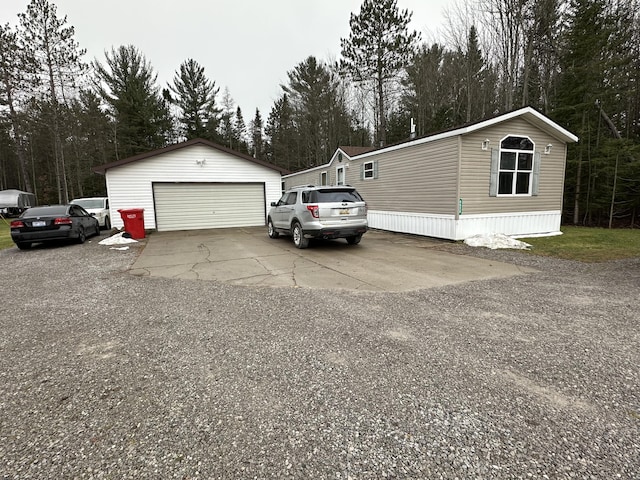 exterior space featuring an outbuilding and a garage