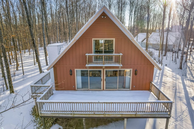 snow covered house with a balcony