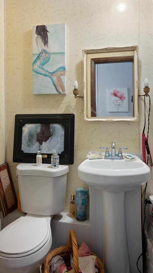 bathroom with toilet and sink