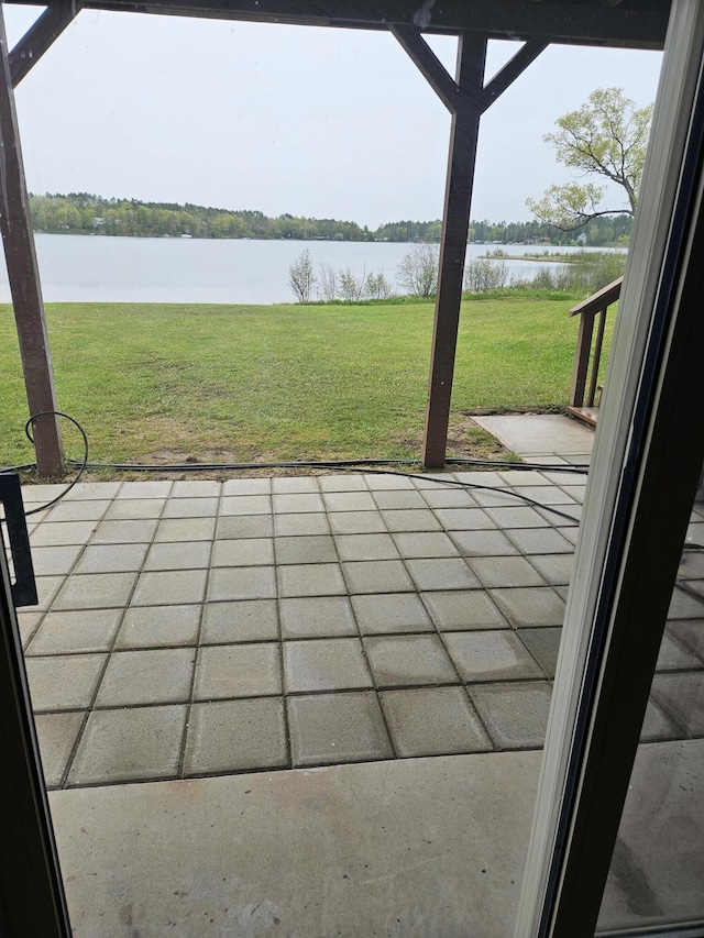 view of patio featuring a water view