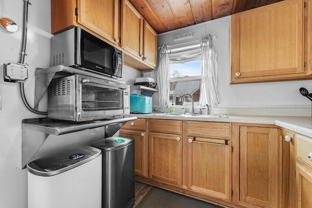 kitchen with sink and wood ceiling