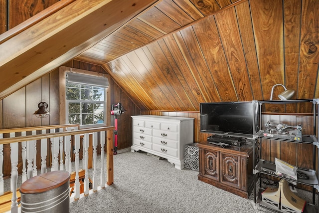 carpeted bedroom with vaulted ceiling, wood ceiling, and wood walls