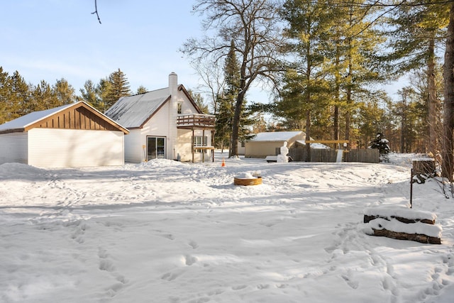 view of front of home featuring an outbuilding