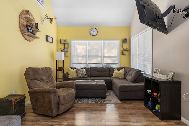 living room featuring dark wood-type flooring