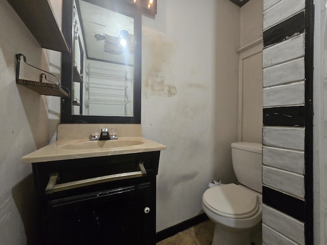 bathroom with toilet and vanity