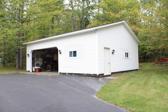 garage featuring a yard