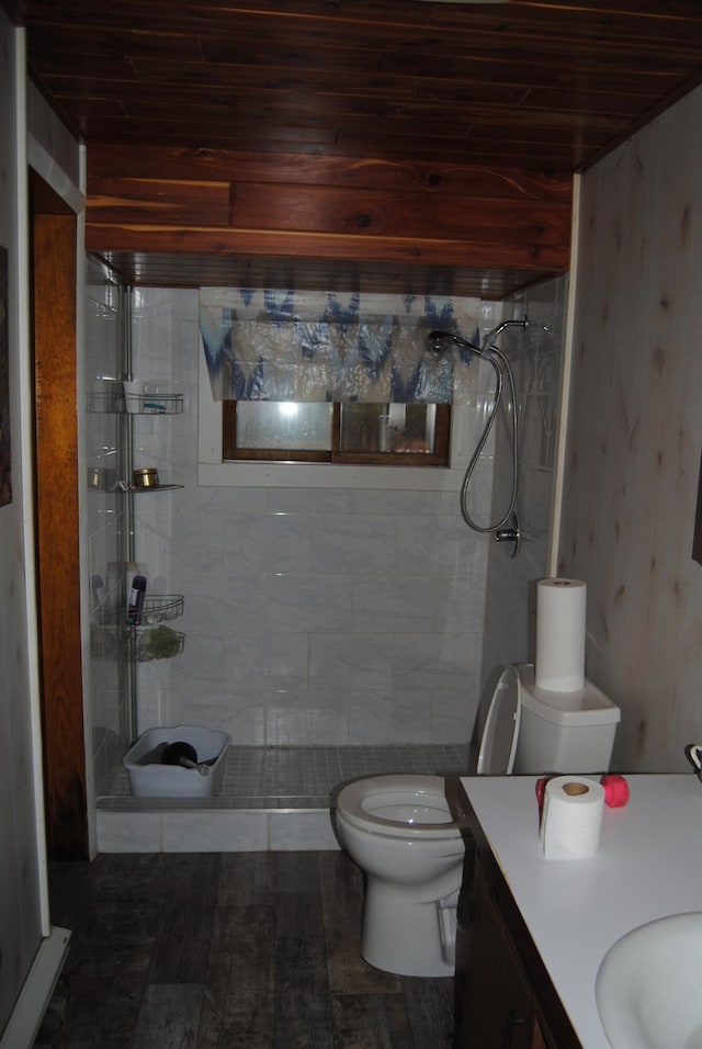 bathroom with vanity, a shower, hardwood / wood-style flooring, toilet, and wood ceiling