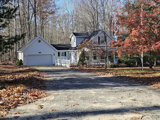 view of front of house with covered porch and a garage