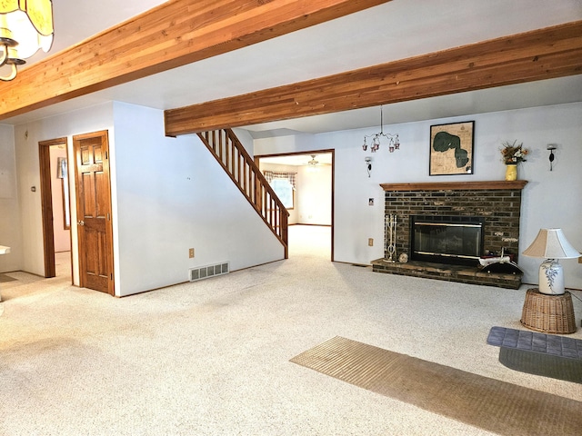 living room featuring a brick fireplace, carpet, and beam ceiling