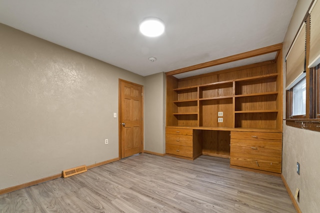 unfurnished office featuring light hardwood / wood-style flooring