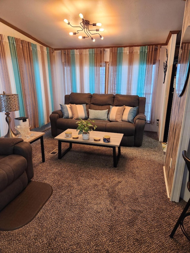 living room featuring a notable chandelier, crown molding, and carpet floors