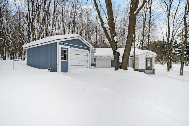 view of snow covered garage