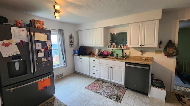 kitchen featuring sink, white cabinets, fridge with ice dispenser, and dishwasher