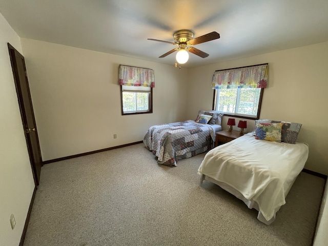 bedroom with ceiling fan and carpet