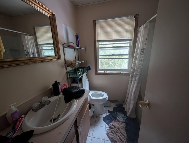 bathroom featuring vanity, a shower with curtain, tile patterned floors, and toilet