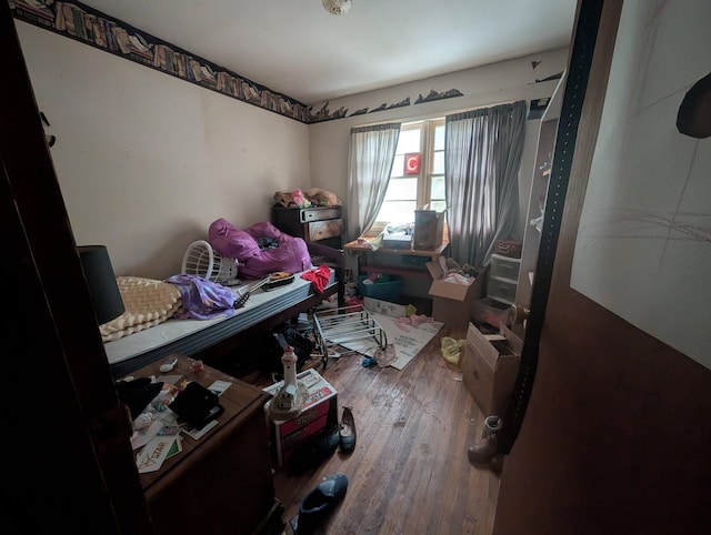 bedroom featuring wood-type flooring