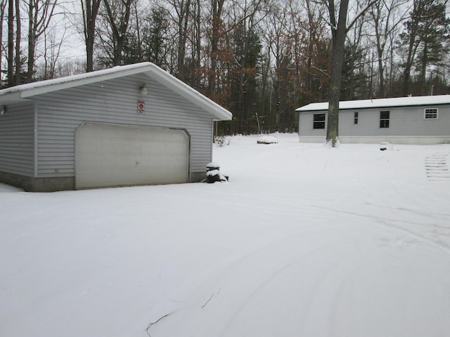 view of snow covered garage