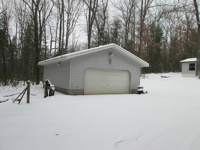 view of snow covered garage