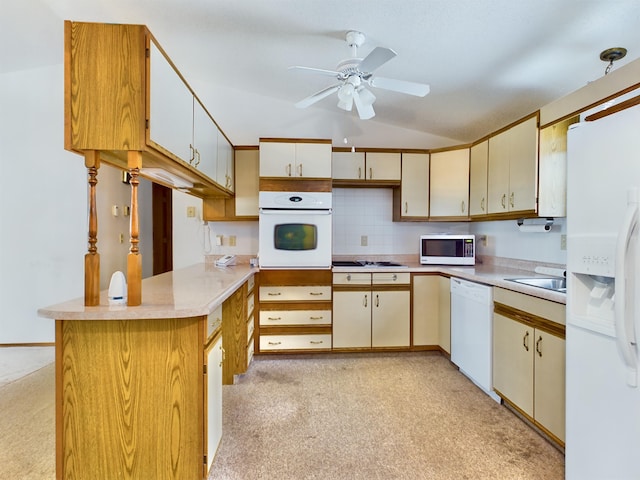 kitchen with white appliances, kitchen peninsula, decorative backsplash, ceiling fan, and sink