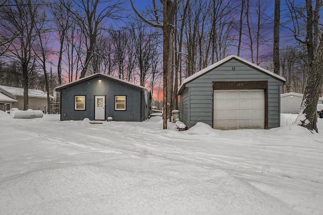 view of snow covered garage