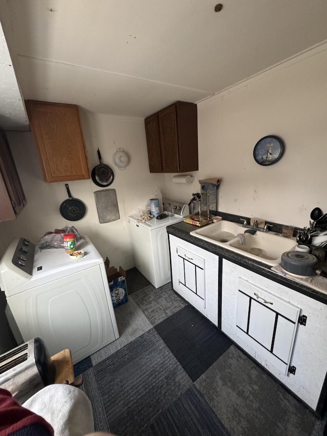 kitchen with separate washer and dryer and sink