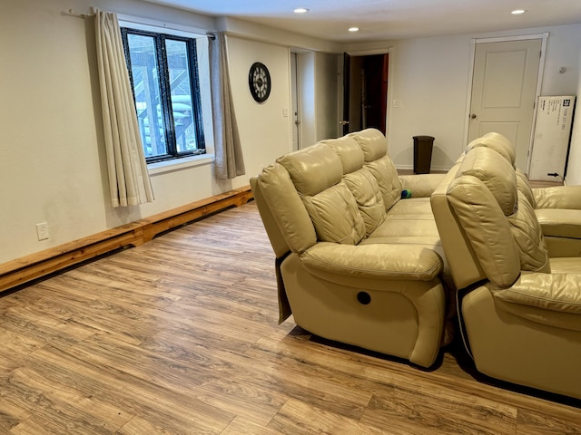 home theater room featuring light wood-type flooring