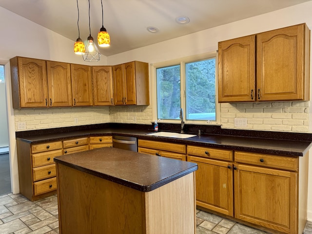 kitchen featuring sink, stainless steel dishwasher, a center island, and tasteful backsplash