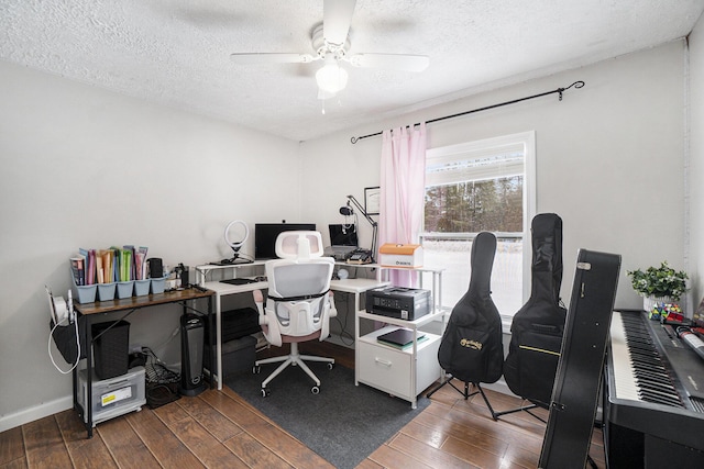 office area with a textured ceiling and ceiling fan