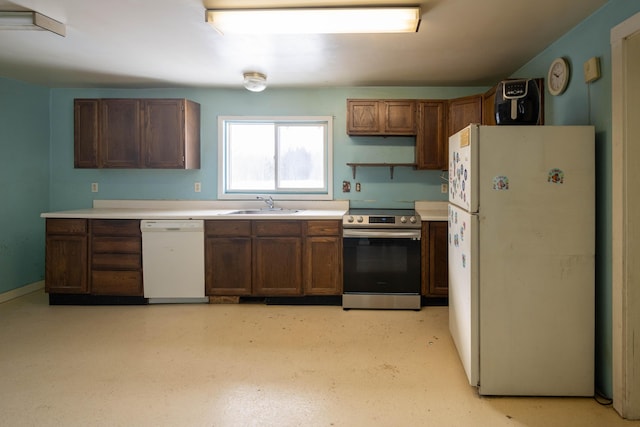 kitchen featuring white appliances and sink