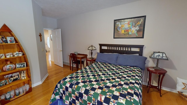 bedroom featuring light wood-type flooring