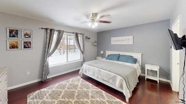 bedroom with ceiling fan and dark hardwood / wood-style flooring