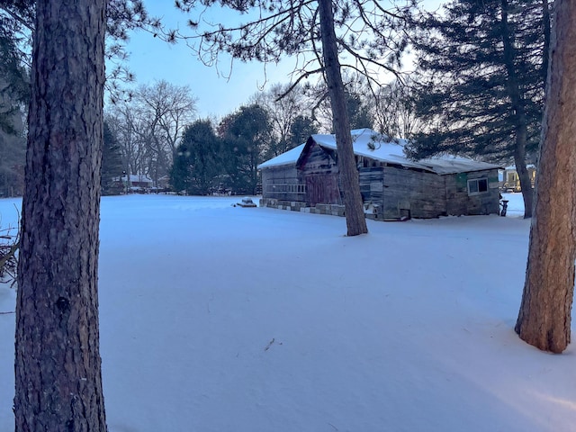 view of yard covered in snow