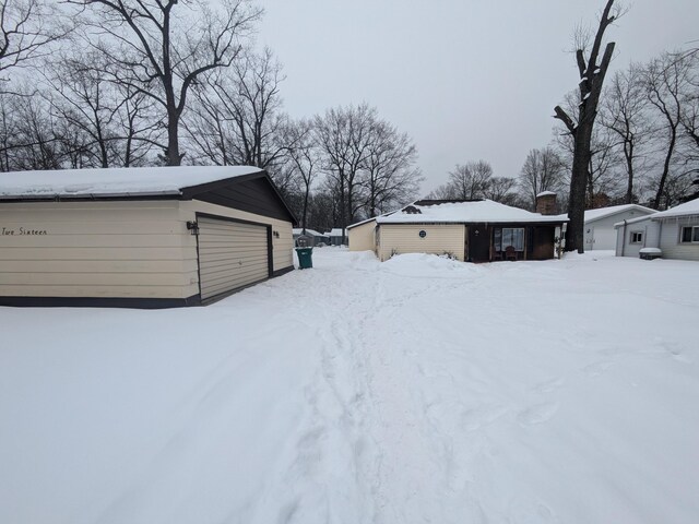 snow covered property with a porch