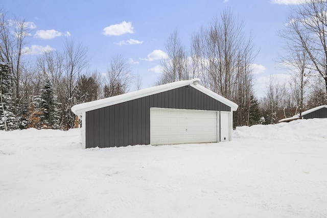 view of snow covered garage