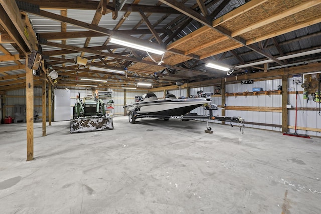 garage with stainless steel refrigerator