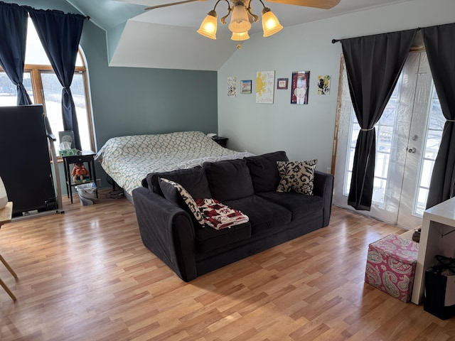 bedroom with lofted ceiling, access to outside, ceiling fan, and light wood-type flooring